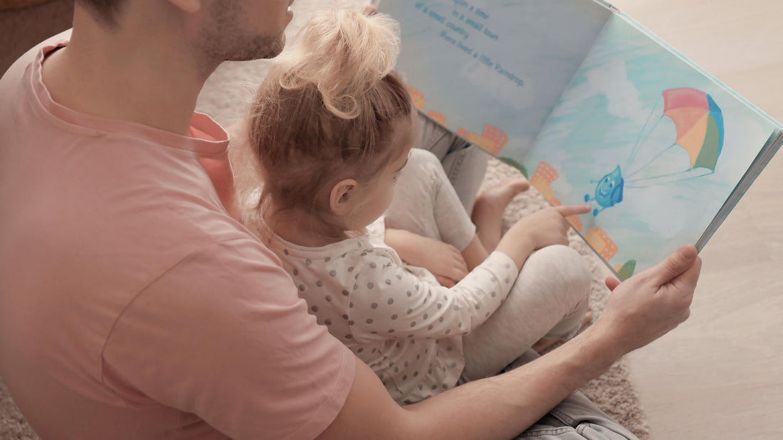 Father and daughter reading together on the floor in a bright room