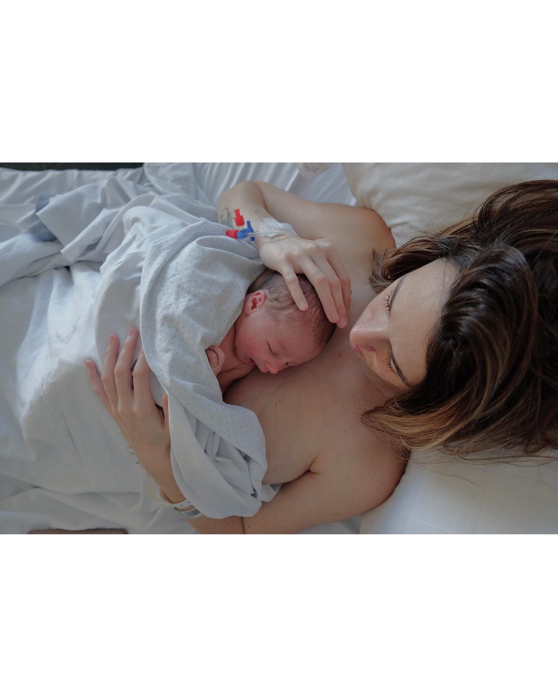 Newborn baby doing skin to skin contact with mother