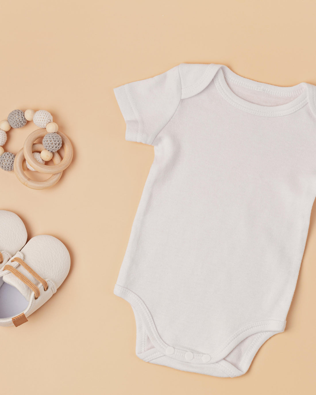Organic cotton baby bodysuit with eco friendly accessories
