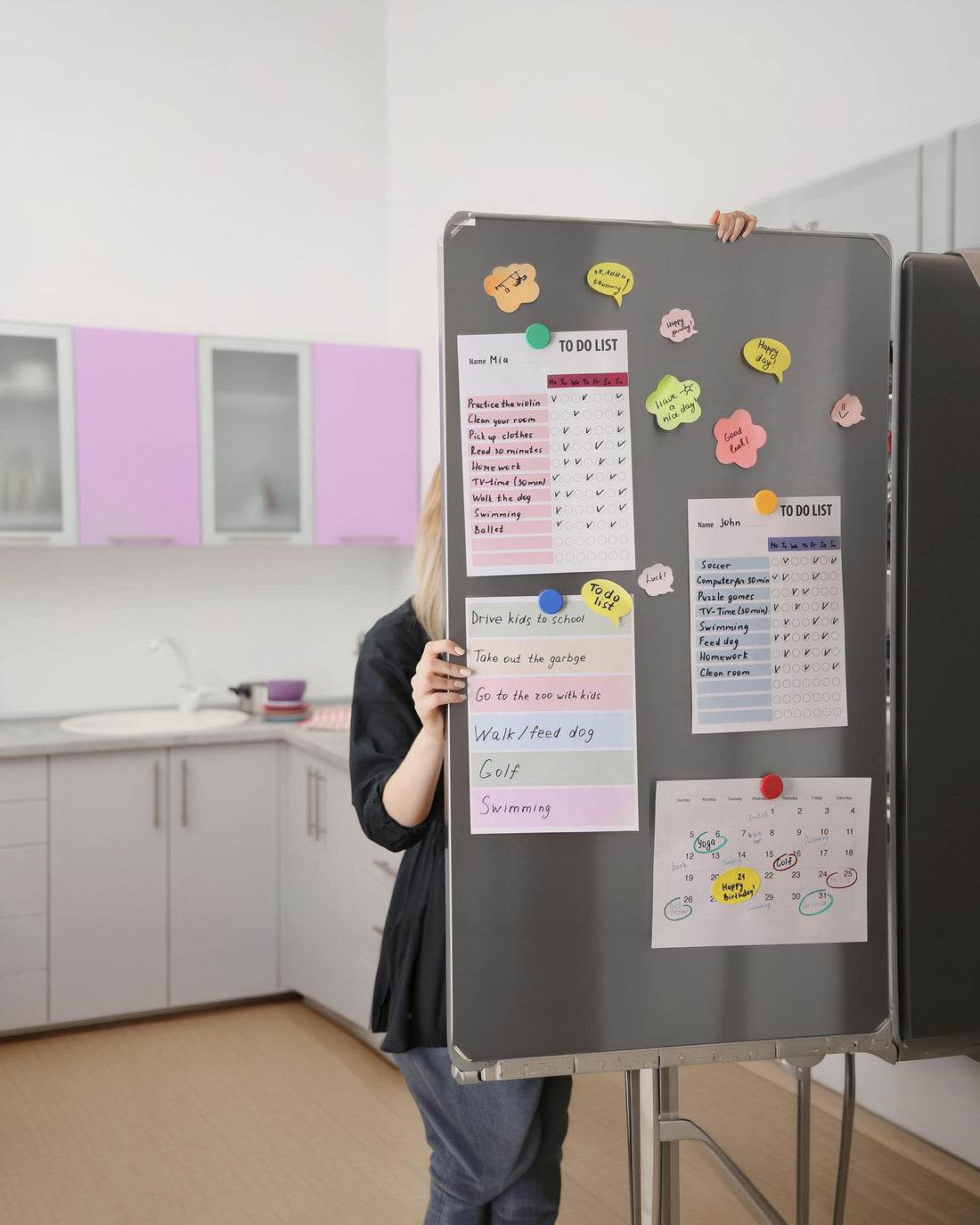 Family calendar and organization notes on a kitchen refrigerator