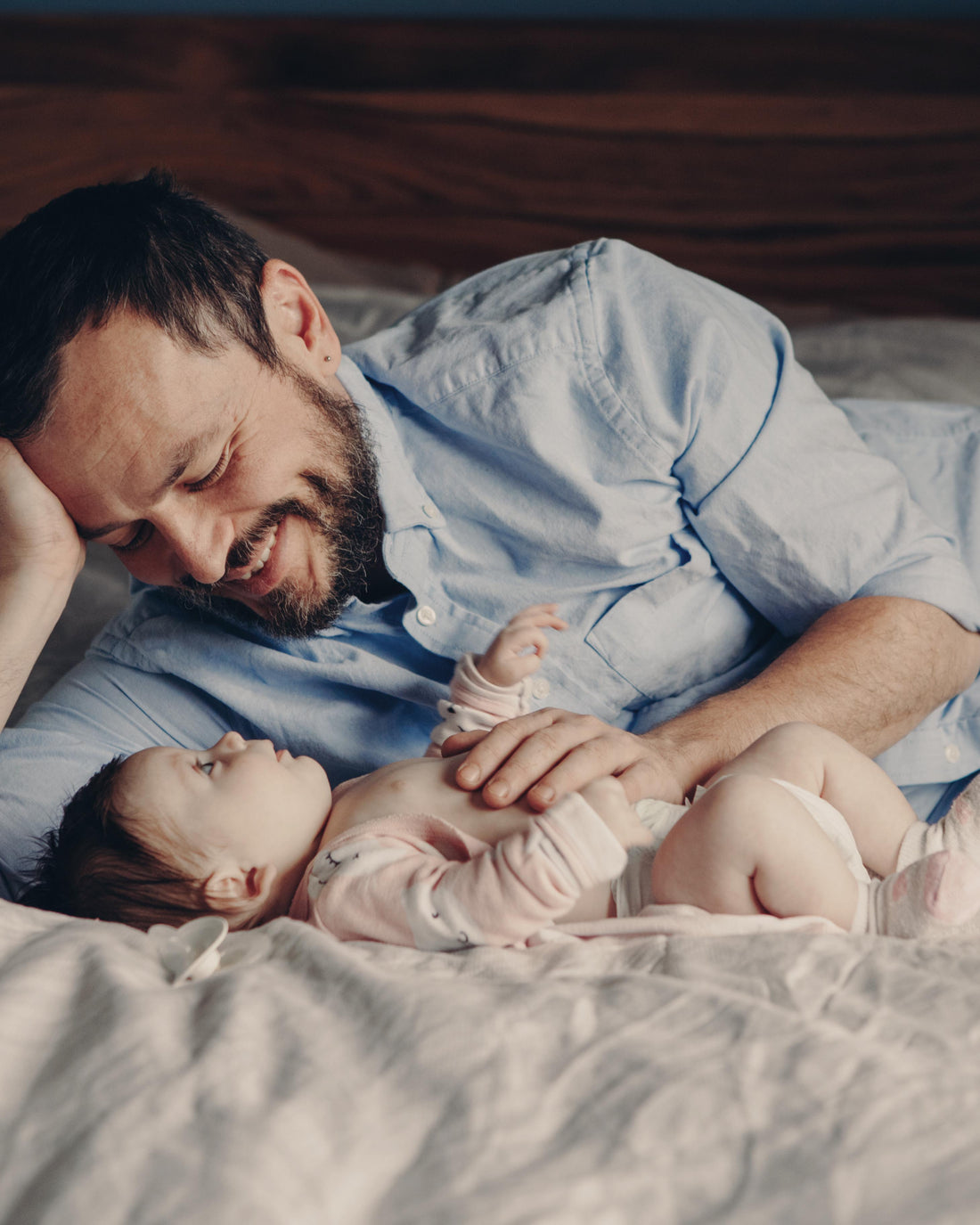 Father talking to his newborn baby