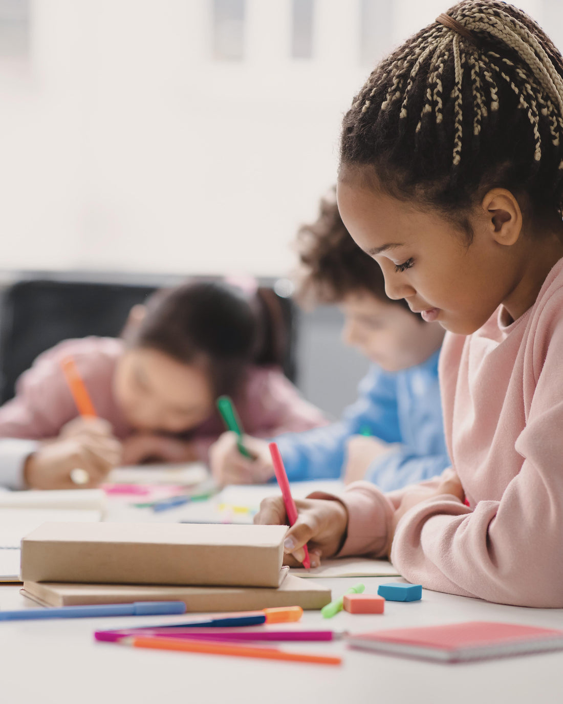 Young girl sitting at a classroom desk