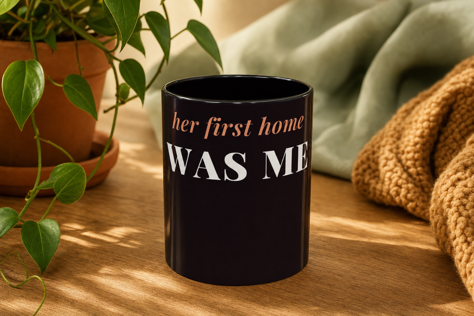 Her First Home Was Me Coffee Mug by Nureli by Kala Library, ceramic mug styled on a warm oak table in soft morning light, premium lifestyle photo