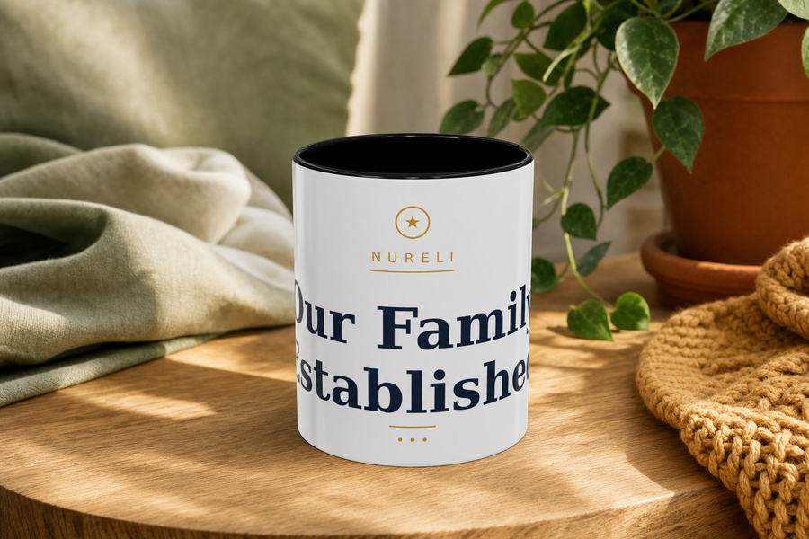 Our Family Established Mug by Nureli by Kala Library, ceramic mug styled on a warm oak table in soft morning light, premium lifestyle photo